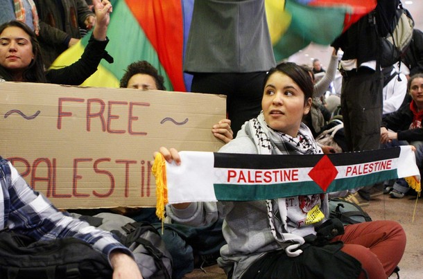 Demonstrators sit as around 100 pro-Palestinian activists stage a protest at Brussels national airport in Zaventem early April 15, 2012. Some 1,200 Palestinian supporters throughout Europe have bought plane tickets for an April 15 visit to the West Bank as part of a campaign called "Welcome to Palestine". Organisers said the aim was to help open an international school and a museum, but Israel has denounced the activists as provocateurs and said it would deny entry to anyone who threatened public order. REUTERS/Sebastien Pirlet