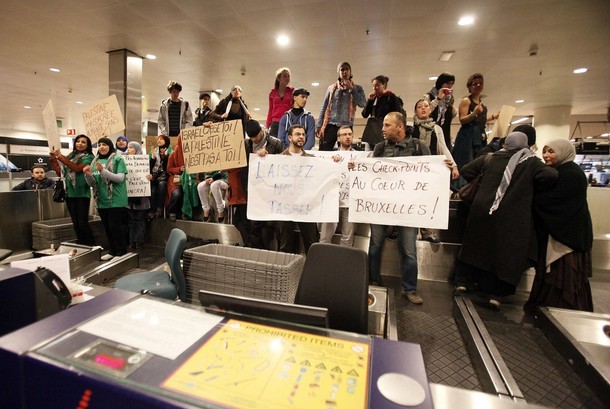 Demonstrators occupy a luggage area as around 100 pro-Palestinian activists stage a protest at Brussels national airport in Zaventem early April 15, 2012. Some 1,200 Palestinian supporters throughout Europe have bought plane tickets for an April 15 visit to the West Bank as part of a campaign called "Welcome to Palestine". Organisers said the aim was to help open an international school and a museum, but Israel has denounced the activists as provocateurs and said it would deny entry to anyone who threatened public order. REUTERS/Sebastien Pirlet