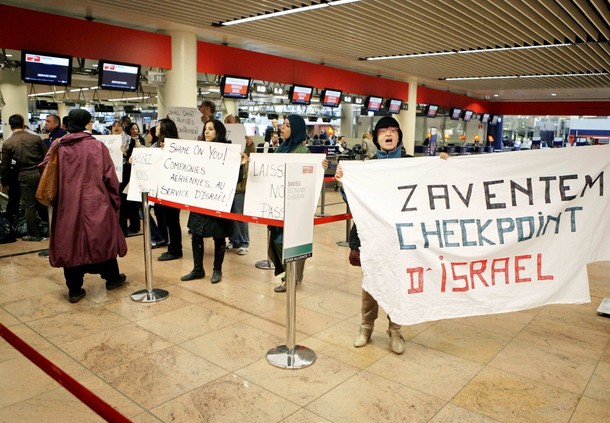 Demonstrators hold banners as around 100 pro-Palestinian activists stage a protest at Brussels national airport in Zaventem early April 15, 2012. Some 1,200 Palestinian supporters throughout Europe have bought plane tickets for an April 15 visit to the West Bank as part of a campaign called "Welcome to Palestine". Organisers said the aim was to help open an international school and a museum, but Israel has denounced the activists as provocateurs and said it would deny entry to anyone who threatened public order. REUTERS/Sebastien Pirlet